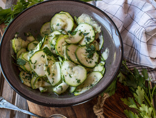 Zucchini salad marinted with vinegar, olive oil, honey and fresh parsley