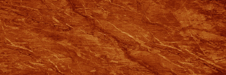 Dark brown orange marble texture. Rust color. Stone background with space for design. Close-up. Backdrop. Web banner. Wide. Panoramic.