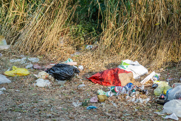 Inorganic waste collected in nature. A close-up view of inorganic waste collected in a pile in nature.