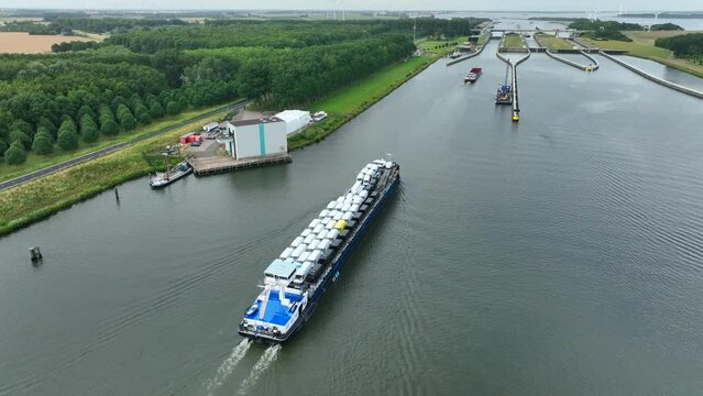 Vehicles Transported by Boat Entering the Volkerak Lock in the Netherlands