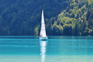 Sailboat on turquoise colored