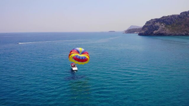 Parasailing In The Tsambika Beach At Summer In Greece. - aerial