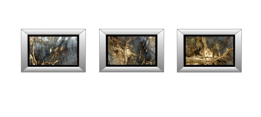 3 silver frames of abstract photographs of the deserts of Africa from the air, on a white wall...