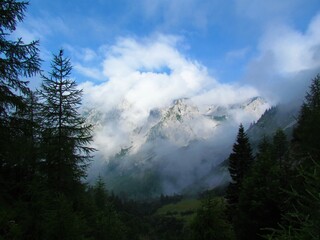 View of mountain Stol in Karavanke mountains covered in clouds in Gorenjska, Slovenia
