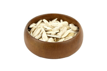 White sunflower seeds in wooden bowl isolated on white