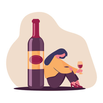 The Concept Of Female Alcoholism. The Unfortunate Woman Is Sitting On The Floor Near A Bottle Of Wine Holding A Glass Of Wine. Sad Drunk Wife Or Alcoholic Mother. Social Problem, Abuse, Addiction.