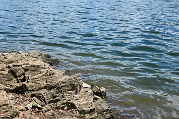 Fototapeta na wymiar Stones on the shore of a lake