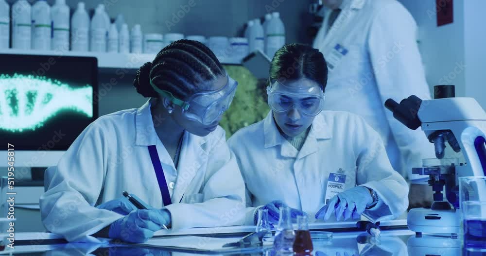 Aufkleber Scientist, chemists or medical engineers using a microscope to test samples and analyze data while writing down their results. Two colleagues researching a virus and its cure in a uv lit lab