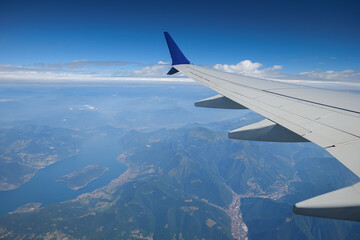 Travel to Italy. Beautiful view from an airplane flying over spectacular Lake Como landmark next to...