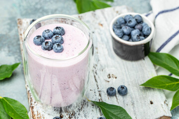 Blueberry jogurt, Homemade berry smoothie. Healthy eating. Diet food yogurt on a light background, banner, menu, recipe place for text, top view