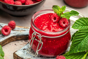 raspberry jam on a white background. Food recipe background. Close up