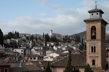Fototapeta na wymiar View from roof on buildings in old central part of world heritage city Granada, Andalusia, Spain