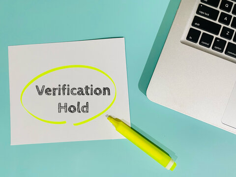 verification hold - text on tiffany blue background