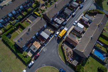aerial view of refuse collecting lorry collecting domestic rubbish from homes using the wheelie bin system, City waste manage and recycling  