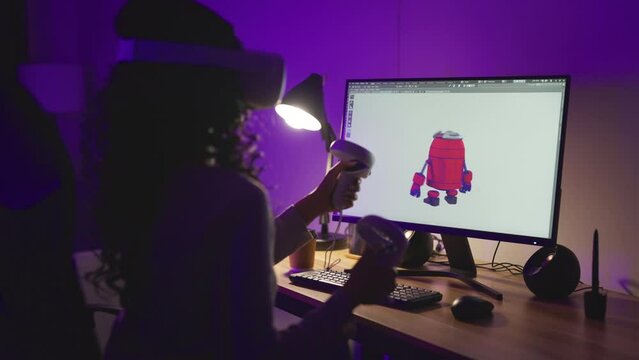 Asian Female Freelancer Working with Inspiration in her Studio at night time. Concentrated Woman Creating her Own Project, She using VR to Control her Games Project by 3D Animation Software.