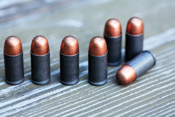 Pistol Cartridges On Wood