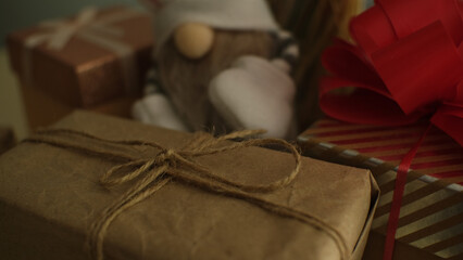 Box with a gift and a gnome. Festive illustration. Selective focus. Blurred background.