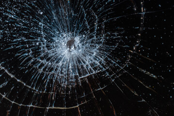 Broken glass texture on black background. Abstract of cracked screen smartphone from shock.