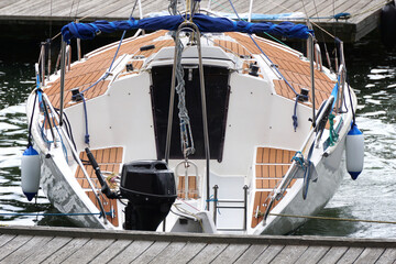Sailboat moored in port - rear view