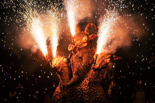 3 head sheep sculpture in firework show "correfoc" in catalonia spain