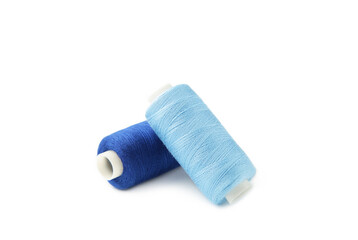 Blue sewing threads isolated on white background