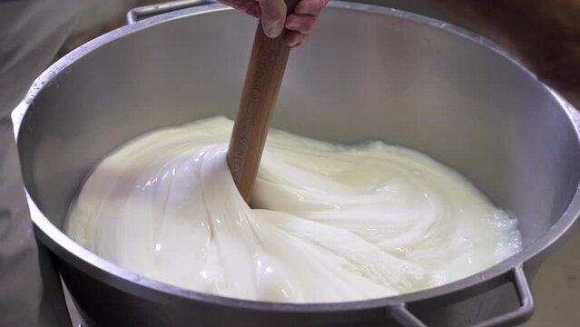 Close up shot of Hands stir and Preparing Mozzarella Cheese, Food Concept