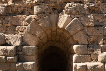 Stone arch and tunnel, part of the grandstand structure of the Roman Theater of Merida, declared World Heritage Site by Unesco as part of the Archaeological Ensemble of Merida
