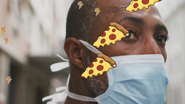 Animation of multiple pizza icons over close up of a african american man man wearing a face mask