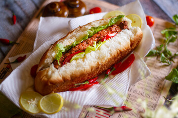 seekh kabab shawarma roll , tomato sauce and drink top view of arabic street food on wooden background