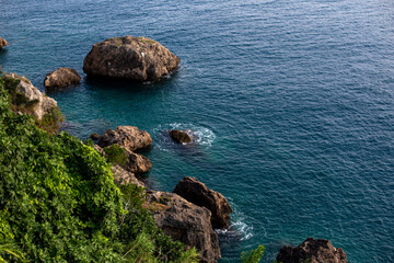 Top view of blue frothy sea surface. Shot in the open sea from above.