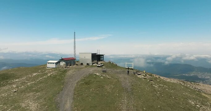 Drone Flying Towards Ski Lodge On Top Of Tskhratskaro Pass, Overlooking Bakuriani In Borjomi District Of Georgia. wide aerial