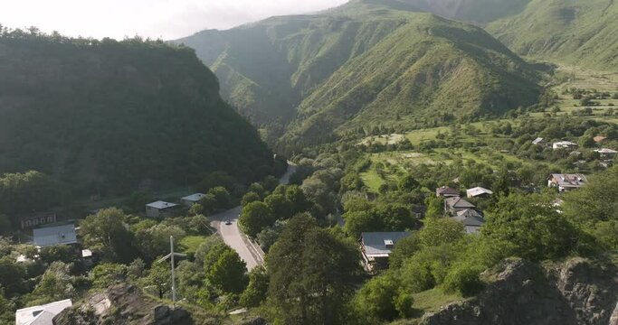 Daba Residential Town In The Foothill Of Mountains In Georgia. - aerial pullback