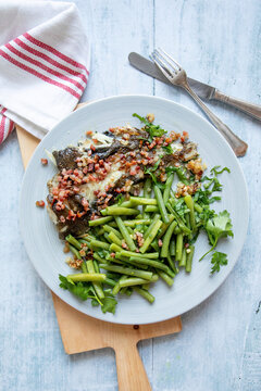 Bacon coated plaice with green beans