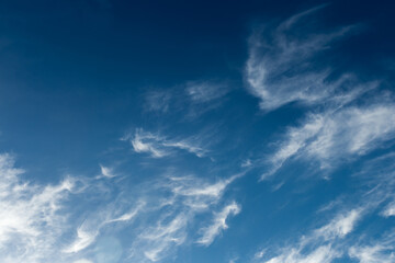 Dark blue sky atmosphere with white air clouds weather wind nature background