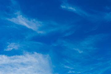 Bright blue sky in the evening with white soft clouds natural background weather air