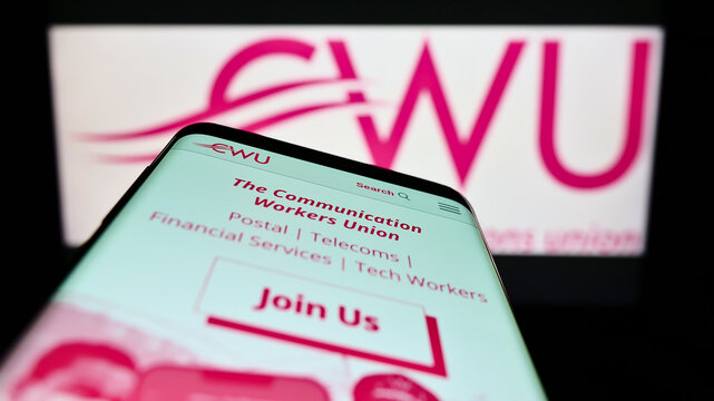 Stuttgart, Germany - 07-23-2022: Smartphone with website of British Communication Workers Union (CWU) on screen in front of logo. Focus on top-left of phone display.