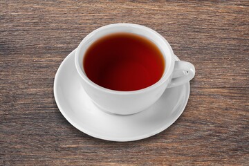 Tasty aroma tea on desk background.