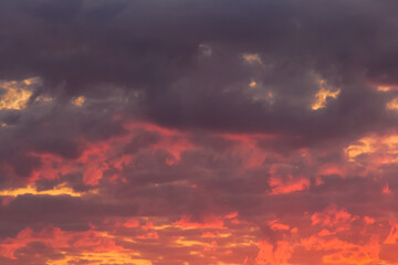 Fototapeta na wymiar Bright red-orange sunset sky clouds summer background nature evening