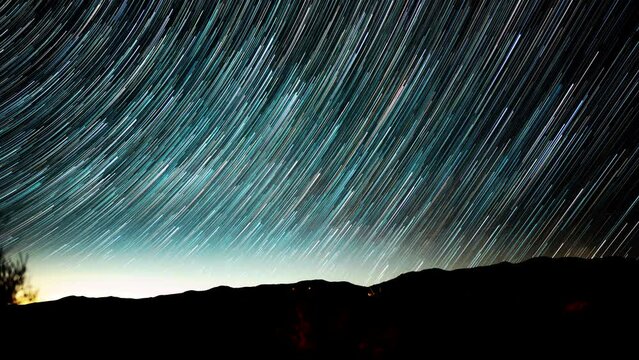 Star trails time lapse with the starr tracing lines of light in the desert sky
