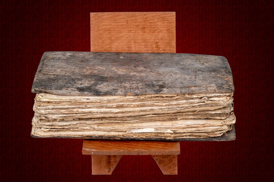 A picture of a century-old handwritten codex with a wooden cover