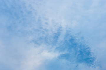 Obraz premium A drawn blue sky with fluffy soft white clouds of natural weather wind background