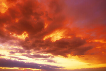Fototapeta premium Beautiful view of orange sky with clouds at sunset