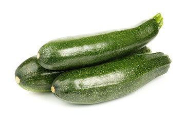 Three large zucchini on a white background, green vegetables.