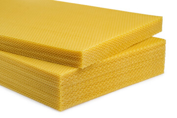 Beeswax. Wax base for honey bee rebuilding on a white background. Honeycombs.