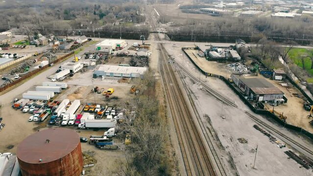 The railway track approaching the industrial center of production and warehouses for the storage of industrial products. Industrial center.