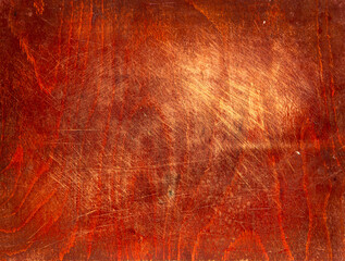 Texture of an old wood cutting board, dark copy space background.