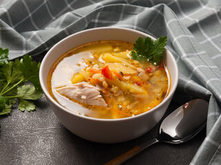 rassolnik with chicken - traditional Russian soup with pearl barley and pickles