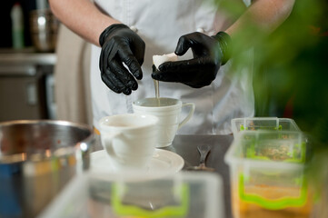 Cook separates the yolk from the protein.