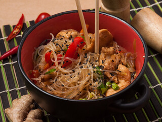 glass noodles with chicken and vegetables in Asian style