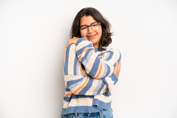 hispanic pretty woman feeling in love, smiling, cuddling and hugging self, staying single, being...